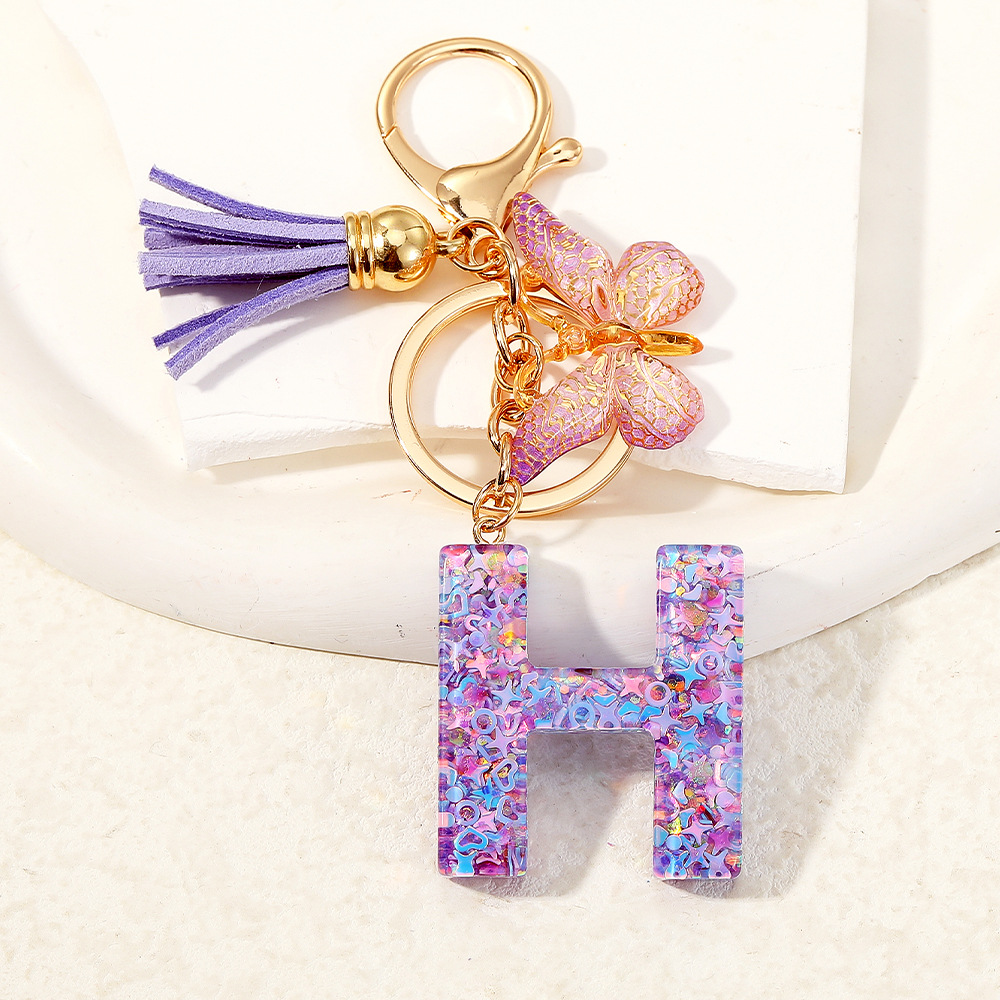 Mayorista transfronterizo mariposa esquinilla iniciales llavero de cristal goteo llavero de letras bolsos colgante