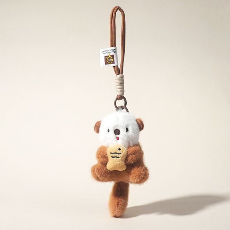 Nuevo lindo pescado nutria de peluche boutique llavero mochila colgante máquina de muñeca marina regalo pareja