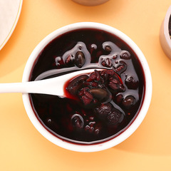 Wholesale black tea in independent small canisters, health-preserving black sesame, black goji berries, black buckwheat, black rice, and mulberry for nourishing black hair with black ingredients.