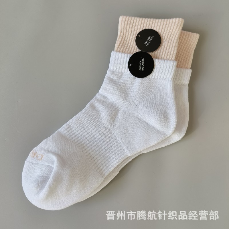 蘇万ナイキの靴下のカラーの二重は男女の中で長い筒のタオルの底のスポーツの靴下をつなぎ合わせてバスケットボールの靴下を走ります。