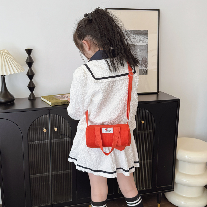 Bolsas de cubos coreanas para niños y niñas, letras de aire extranjero, bolsas de viaje casuales para niños, 2025 nuevas bolsas de lona para niños