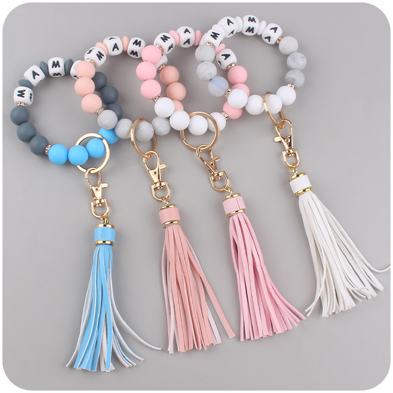 Nuevo cuero pu borla colgante creativo DIY nombre silicona con cuentas leopardo contraste color colgante pulsera llavero