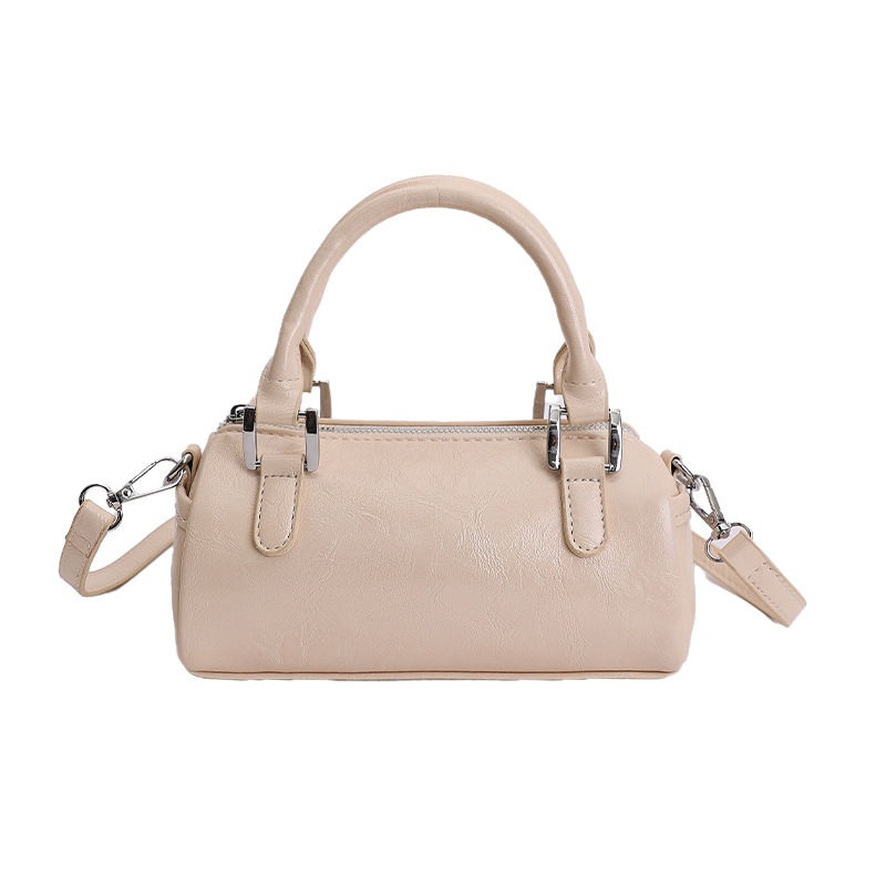 Nicho de diseño retro bolso de mano mujer 2026 primavera nuevo bolso de hombro sensación diaria de moda oblicuo bolso cilíndrico