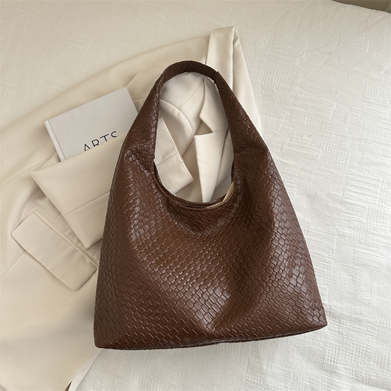 Otoño y invierno retro bolsos de dos piezas 2024, bolsos de moda de mujer, bolsos de hombro portátiles extranjeros, bolsos simples.