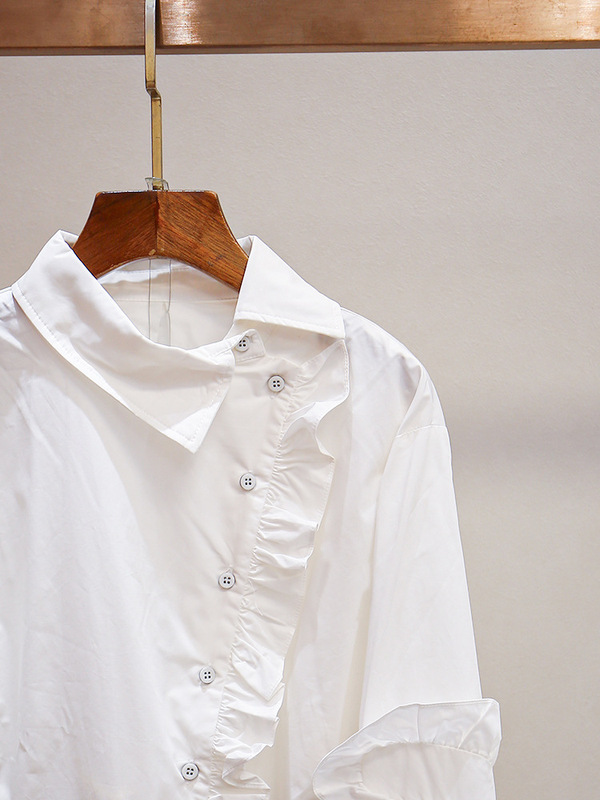 深センの南油のハイエンドの婦人服の新型のフランス式のデザイン感の木の耳元の襟の斜めの長袖の単列はシャツのスカートを掛けます。|undefined