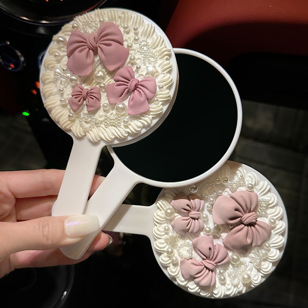 Handheld bow tie with bow pearl