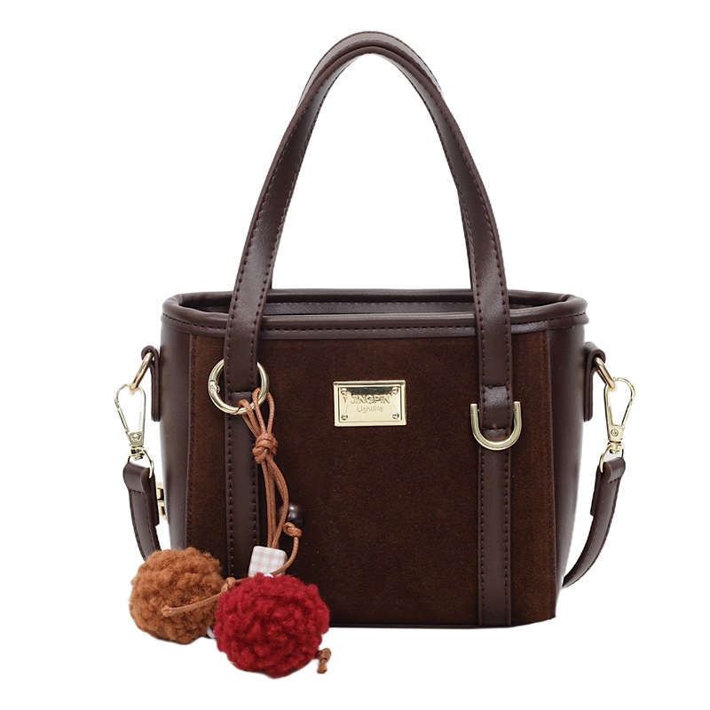 Bolso coreano retro de alta calidad bolso de cubo de agua mujer otoño / invierno 2025 nuevo simple bolso de hombro mochila casual