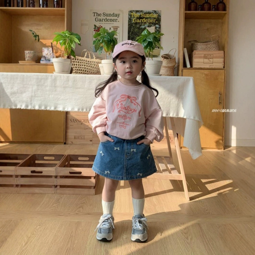 Ropa infantil coreana nueva falda de mitad primavera y verano niñas bordadas con arco lavado con agua vaquero estilo extranjero en forma de A falda de mitad