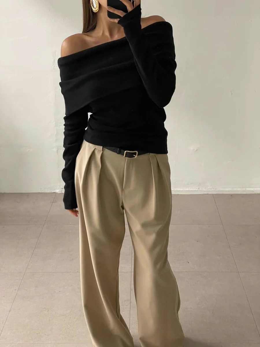 Cross-border 2026 nuevo estilo europeo y americano un hombro temperamento de diseño de hombro abierto sensación delgada envuelta en un suéter de punto de punto para mujeres