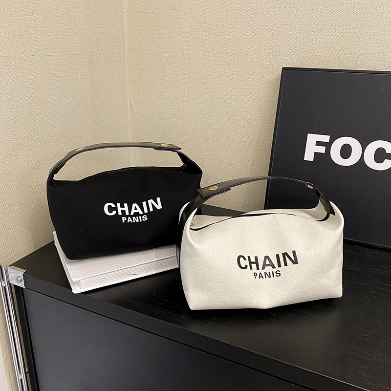 Bolsa de maquillaje de lona simple, nuevo estilo de aire extranjero, bolsa de mano de gran capacidad de almacenamiento, bolsa de almacenamiento simple para viajes