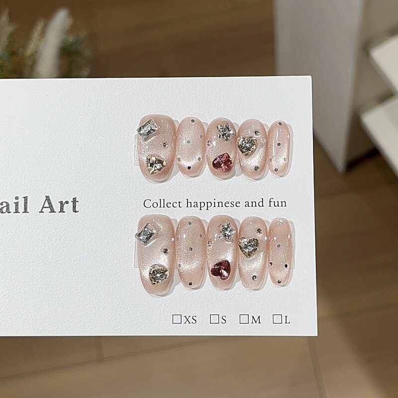 A Cute and Fluffy Strawberry-Themed Nail Art with Glass Beads, Cat Eye, Heart Stickers, and Polka Dots