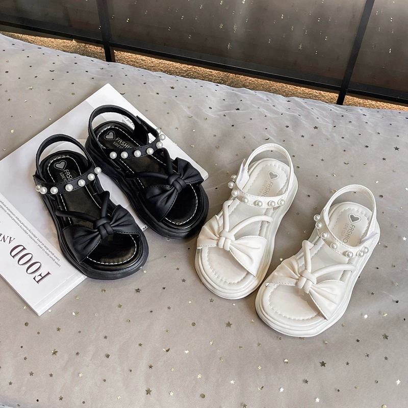 Девушка бант римские сандалии 2025 новый жемчуг мягкая подошва нескользящая пляжная обувь маленькая девочка обувь принцессы
