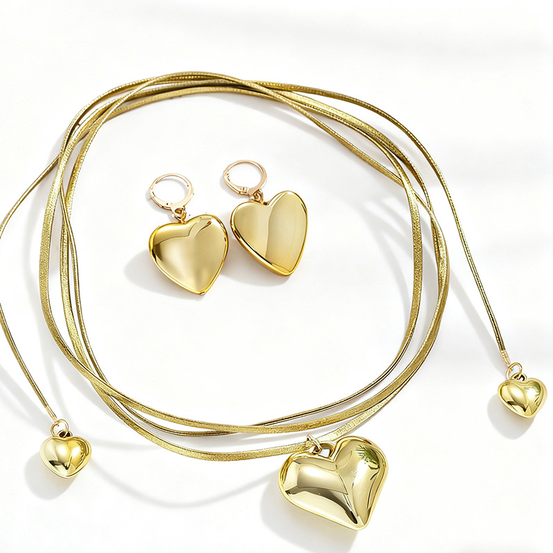 Collier et boucles d'oreilles pendantes haut de gamme pour femme, avec pendentif cœur, cordon en cuir et chaîne à plusieurs rangs._voghion.com