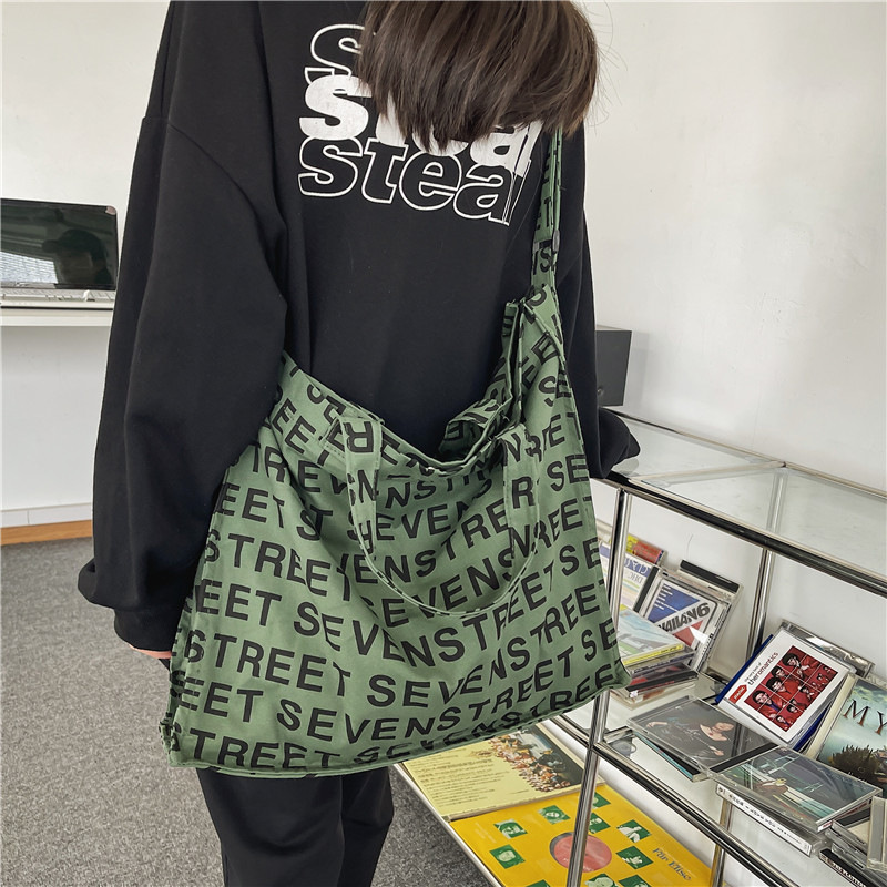 Bolso Tote de lona de gran capacidad para mujer 2024 nuevo bolso de hombro de estilo occidental de moda casual bolso de mensajero portátil de todo fósforo marea