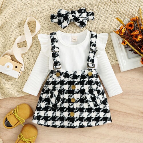 Baoxin children's clothing foreign trade Korean version autumn and winter pit strip top bow flying sleeves plaid suspender skirt girls two-piece suit