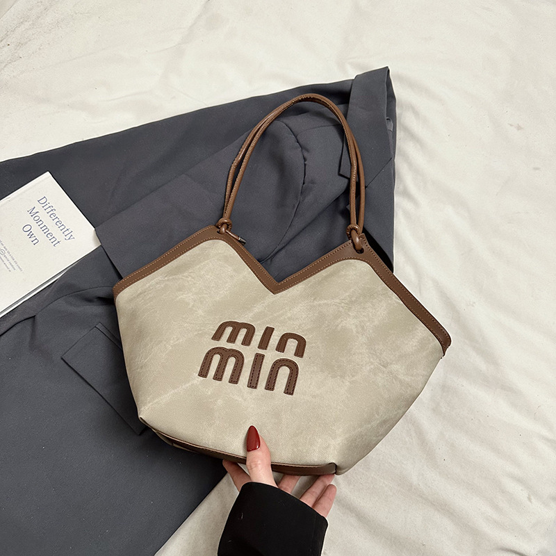 2024 nueva bolsa de gran capacidad para mujeres, bolso de hombro Sen Meng, bolso de diseño de nicho, bolso de viaje de alta calidad para mujeres