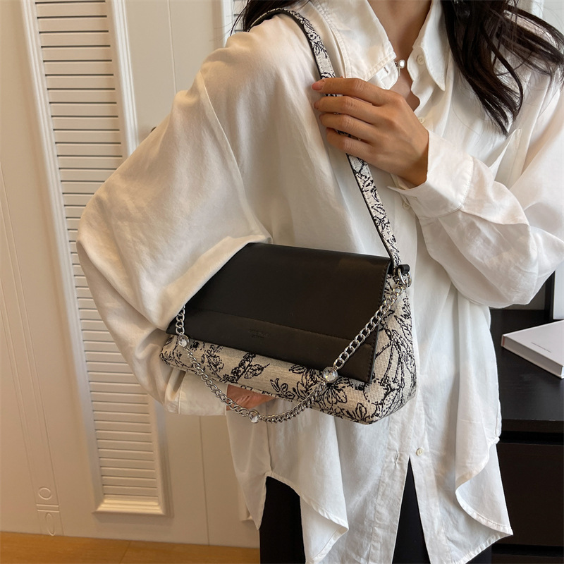 Diseño coreano de nicho simple bolso de hombro de color contraste para mujeres verano 2026 nuevo estilo diario bordado bolso de viaje al trabajo