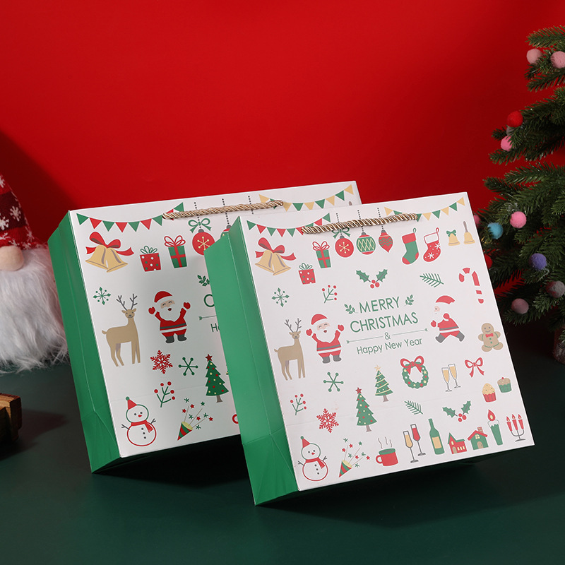 新しいクリスマスプレゼント袋クリスマスプレゼント袋赤い平安夜紙袋の大きなマフラーは包装袋を持っている|undefined