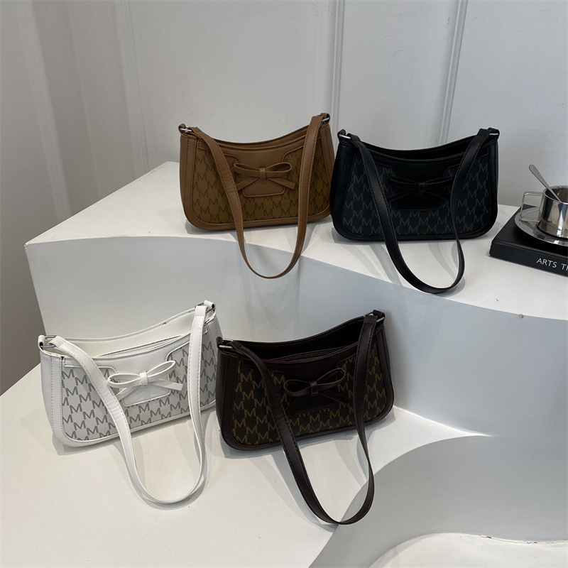 2025 primavera nuevo estilo simple ocio retro bolso de brazo bolso de moda de mujer bolso de nicho coreano bolso de hombro