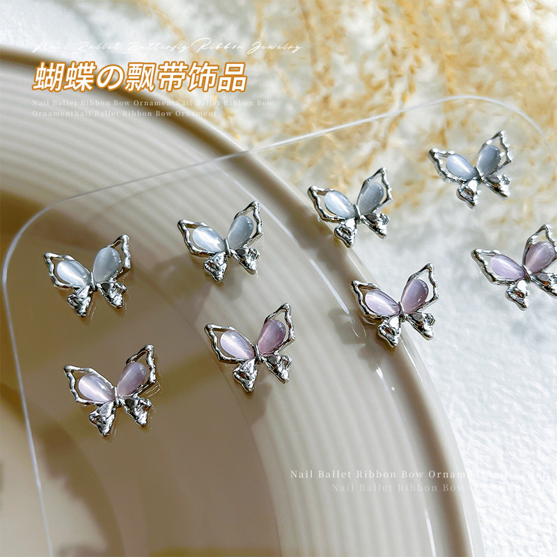 Dream butterfly ribbon nail jewelry gentle cat's eye stone alloy hollow bow wear armor small jewelry wholesale
