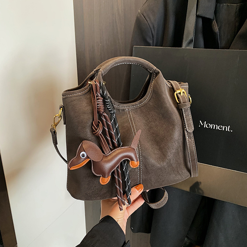 Transfronterizos viajeros bolsas de mano retro mate bolsas de balde de mano mujeres otoño e invierno 2025 nuevo mochila de hombro