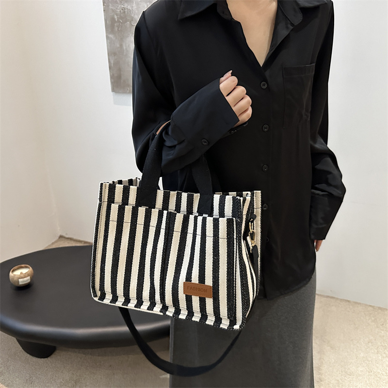 Bolsas de gran capacidad de transporte 2024 nuevas bolsas de mujer populares bolsas de lona a rayas bolsas de mochilas de moda bolsas de mano