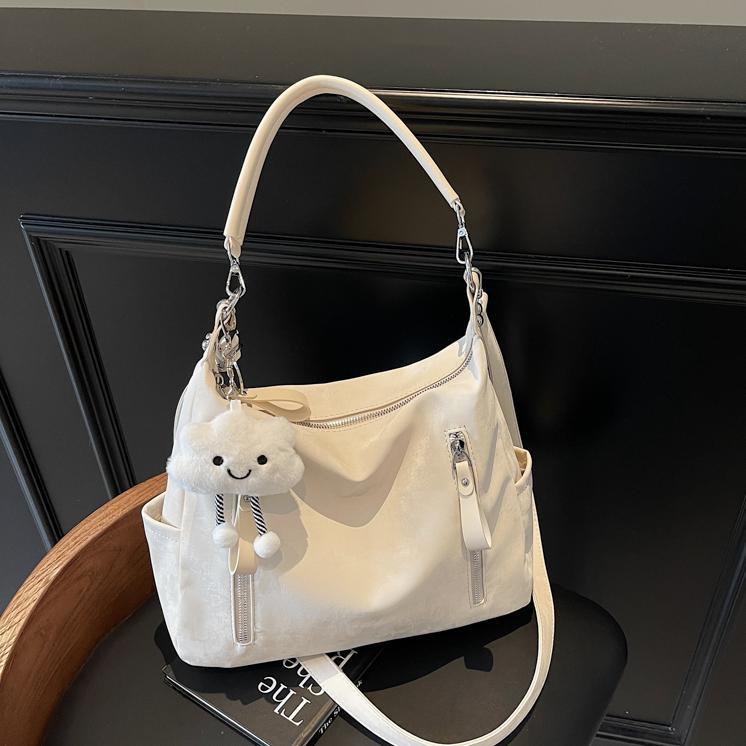 Bolsa suave Pitot para mujeres de gran capacidad 2025 nueva alta sensación de bolso de mano de viaje simple mochila de bolsillo casual