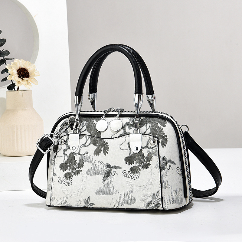 Fabricantes de bolsos de mujer bolsos de mano atmósfera textura bolsos de hombro de gran capacidad bolsos de mochilas bolsos de comercio exterior