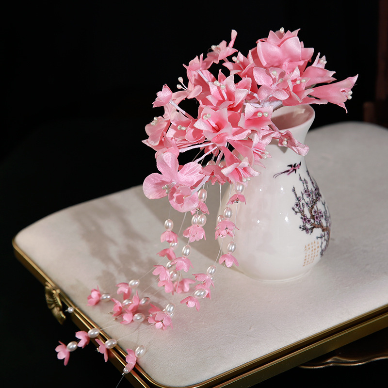 Fuchsia hair accessory, orchid