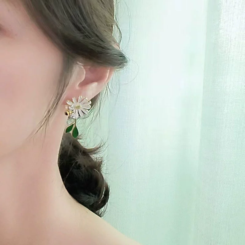 Design asymmetrical earrings, trend of season, flowered