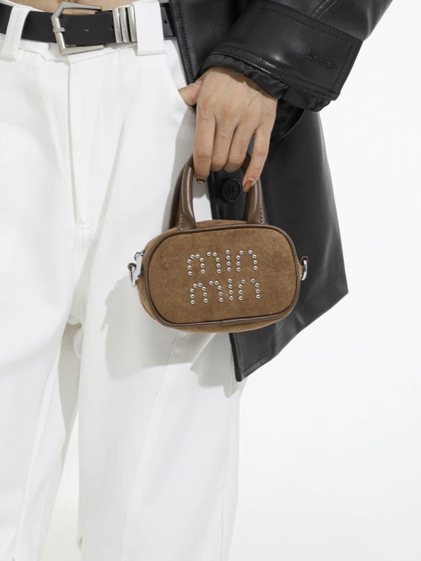 Alta sensación retro de seda mini bolso de mano para mujeres 2025 nuevo alta sensación de humedad de moda mochila