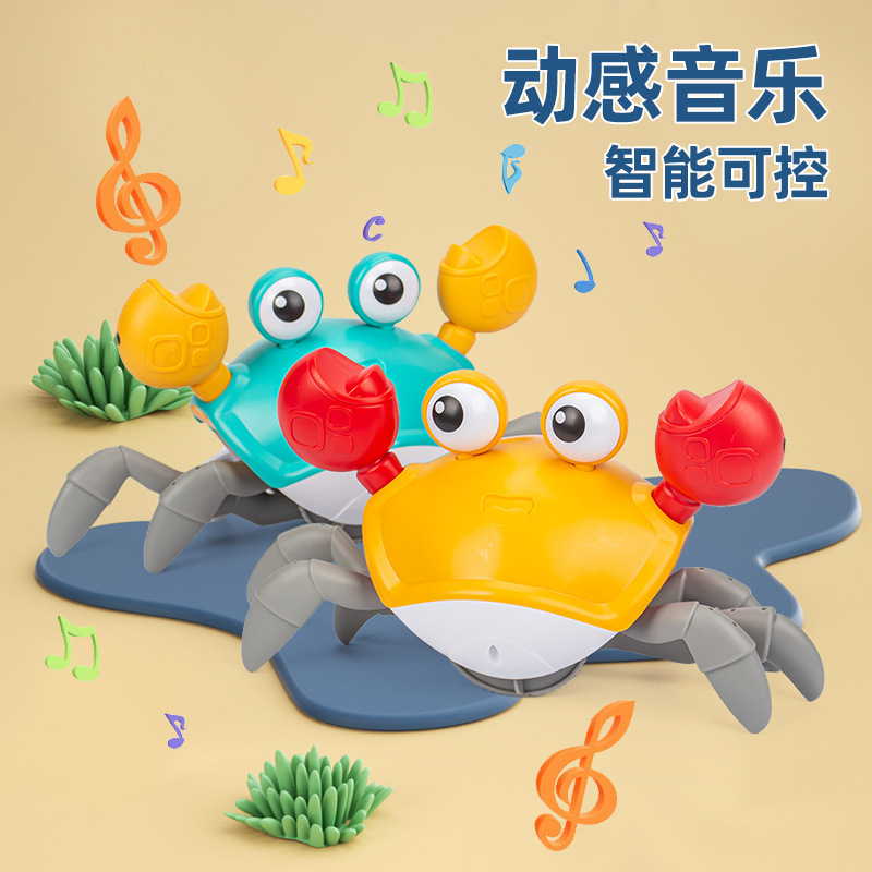 国境を越えた子供の電気誘導カニのおもちゃの赤ちゃんは歩くことができます。