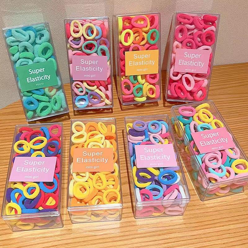 Asequible caja de almacenamiento de Corea del Sur de los niños pequeño tamaño cabeza cuerda bebé toalla anillo no duele pelo cabeza cuerda macaron pelo anillo