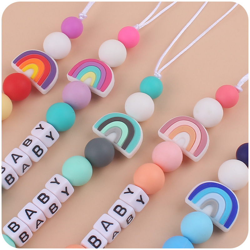 Nuevos suministros para bebés chupete Cadena de dibujos animados lindo arco iris de silicona pequeña cadena anti-caída mordedor