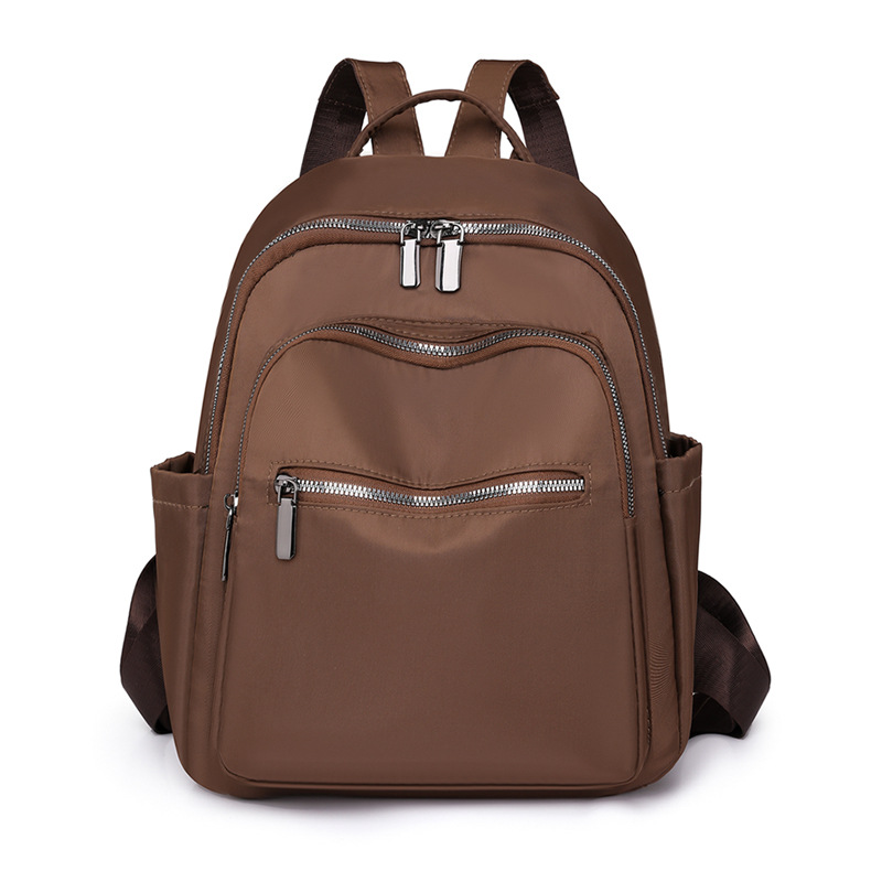 2023 nueva mochila de tela Oxford de color sólido para mujer, arte urbano, viajero, mochila de viaje ligera, mochila escolar al por mayor