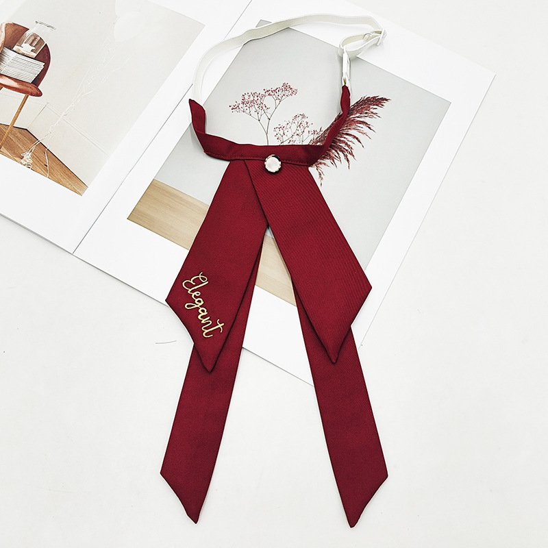 Fabricante spot color sólido jk pajarita versión coreana femenina estilo universitario arco foto de graduación traje de soltero bordado cuello flor serpentina