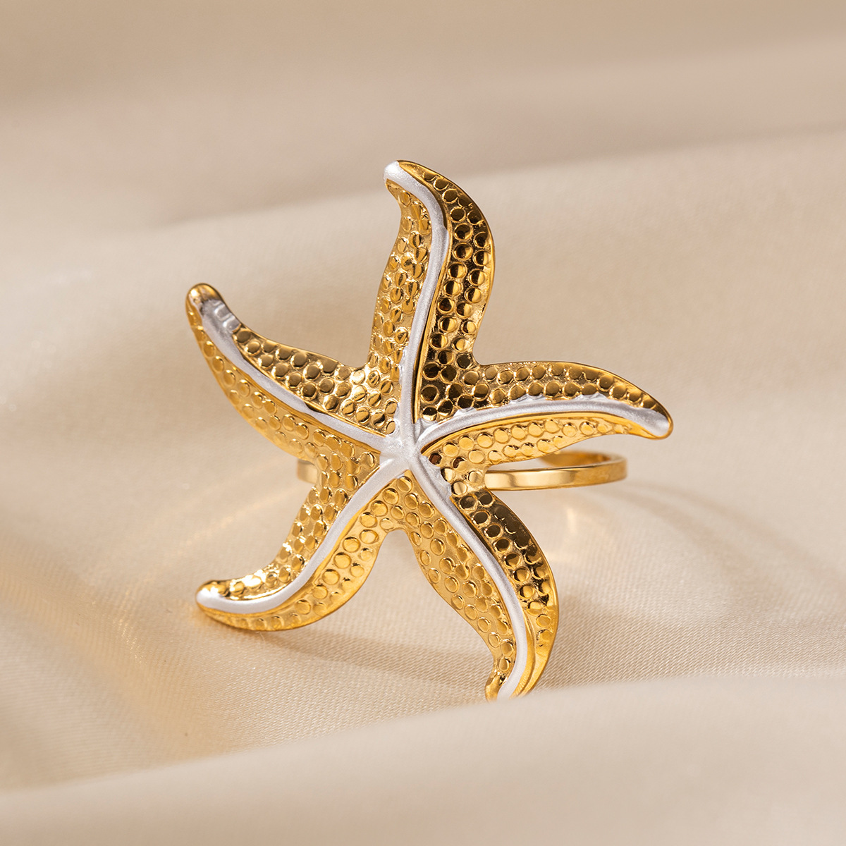 Anillo de acero inoxidable europeo y americano de Tena, sentido de nicho de alta gama, estrella de mar, playa, viento de vacaciones, anillo de acero de titanio, lujo ligero femenino