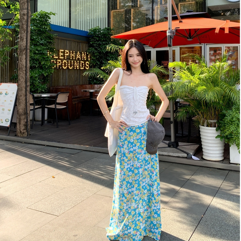 Beach Vacation Style Outfit with a Pure and Desirable Design: White Halter Neck Tube Top and Blue Floral Print Skirt Two-Piece Set Beach Vacation Style Outfit with a Pure and Desirable Design: White Halter Neck Tube Top and Blue Floral Print Skirt Two-Piece Set