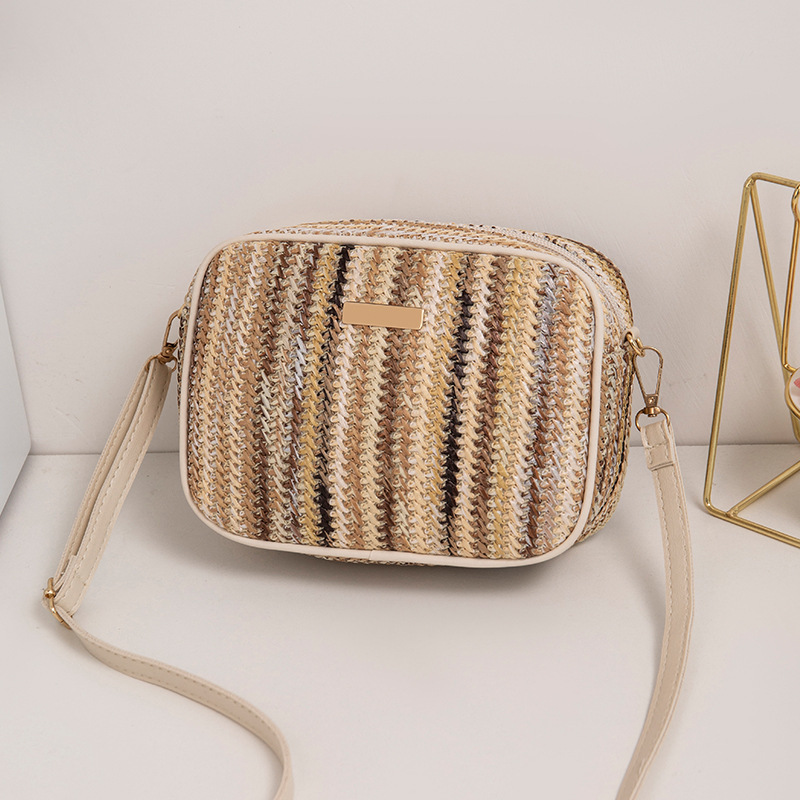 Fábrica directa 2023 nuevo estilo simple de moda de calle de paja bolsa de moda trenzada estilo extranjero de moda mochila de hombro image 10