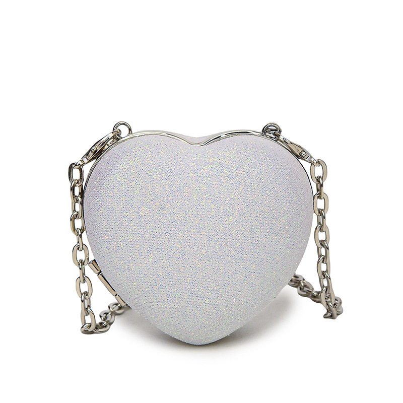 Pequeño viento japonés de fragancia personalidad de color caramelo de corazón de melocotón mini auriculares para mujeres bolsas de 24 verano nuevo hombro mochila