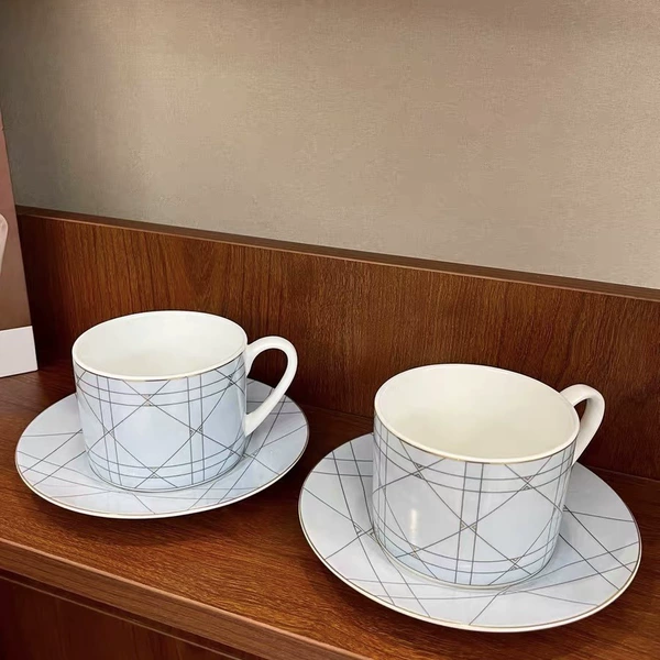 Blue geometric double cup and saucer