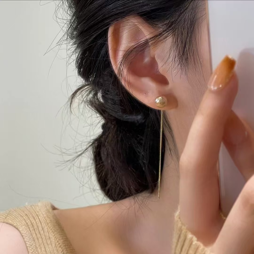 Nuevos cuentas de champagne con bordillos largos, líneas de orejas delgadas, diseño de personalidad simple y sofisticado, auriculares de alta calidad