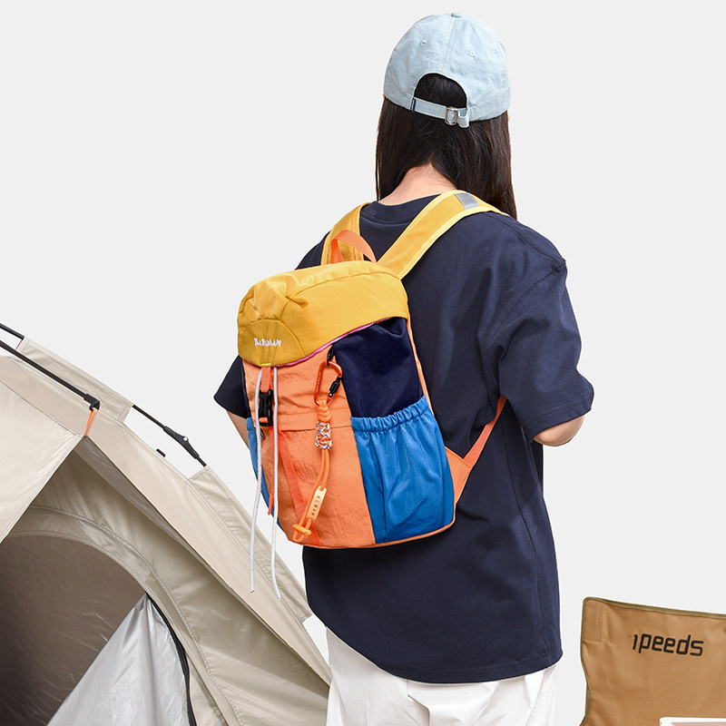 Mochila escolar impermeable estudiantes de viento color empalme ligero al aire libre nueva 2026 mochila de viaje mochila de gran capacidad