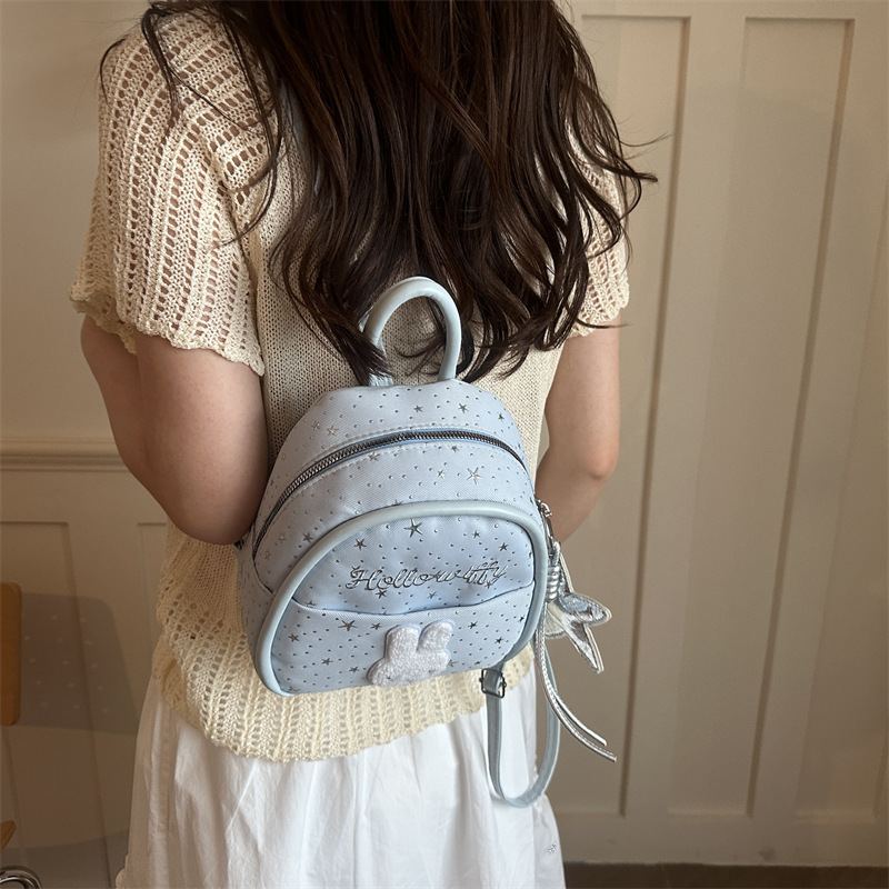Nicho colegio estilo mochila portátil mujer 2026 nueva moda simple dibujos animados versátil viaje ocio mochila de moda