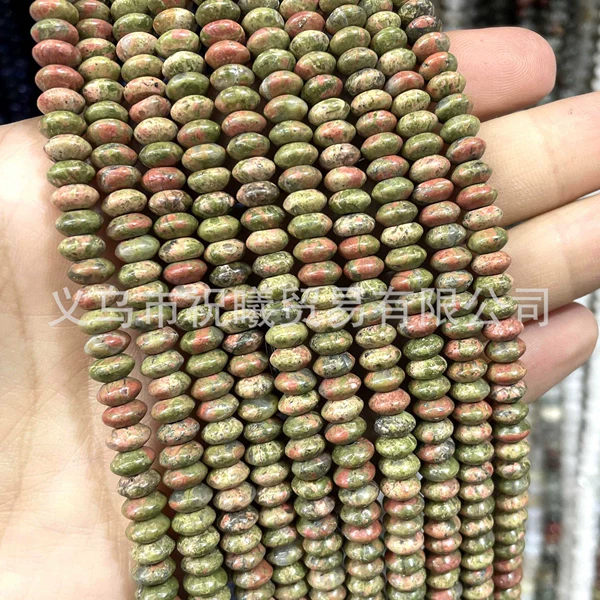 Patterned green disc bead