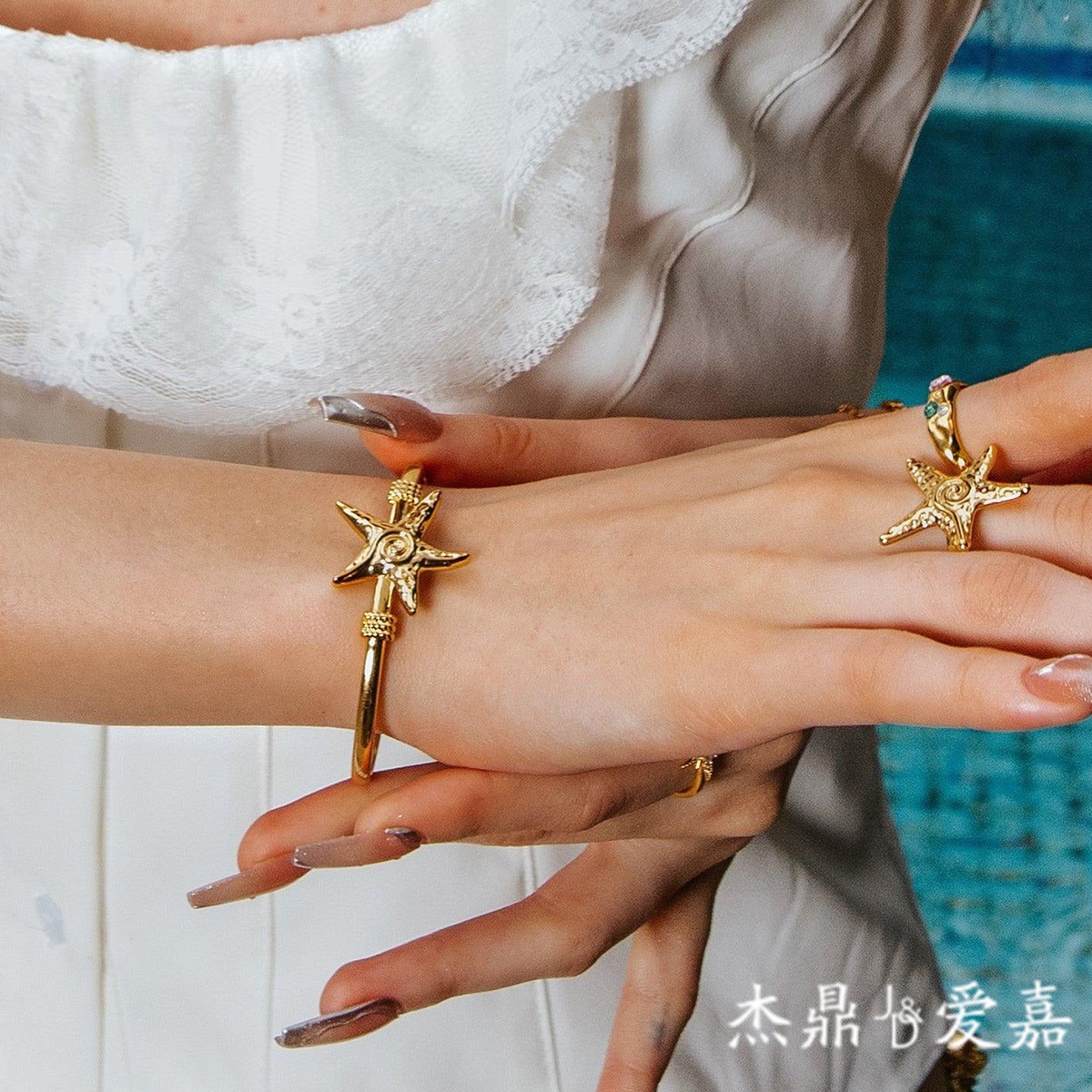 Jieding Europa y América Pulsera abierta de estrella de mar de acero inoxidable Pulsera de océano de sentido avanzado Pulsera de acero de titanio Bracelet transfronterizo