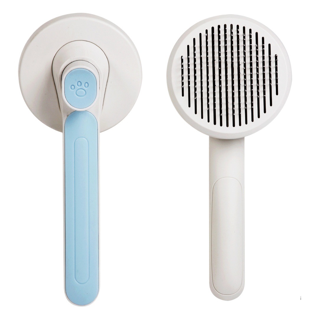 Transfronterizo nuevo peine para mascotas gato y perro universal de limpieza automática de Peine macaron de color mascota flotante peine de masaje para el cabello