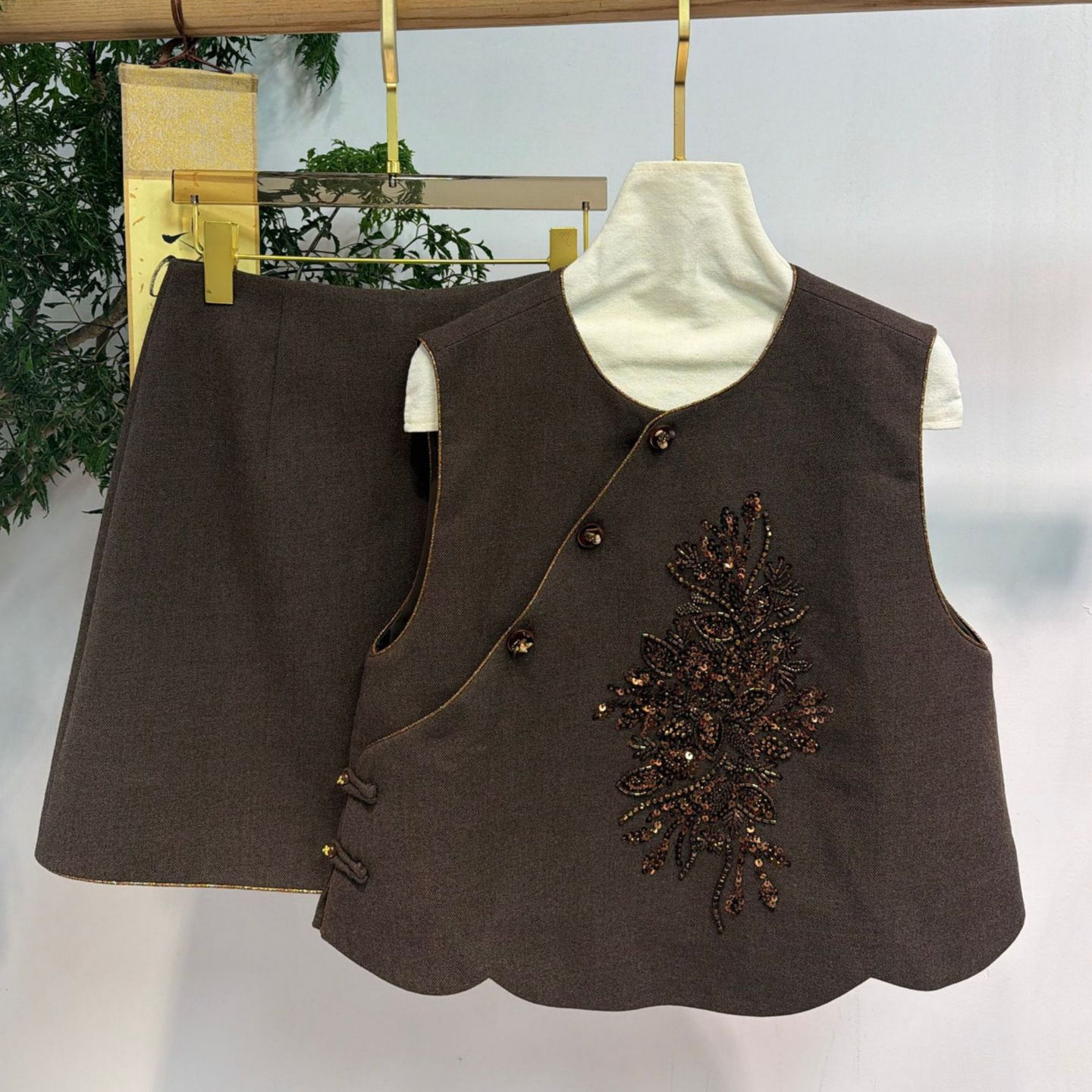 New Chinese-style rayon suit with diagonal placket, elaborate French embroidery, beaded detailing, and a wavy hemline; includes a vest and a skirt, a two-piece Tang suit