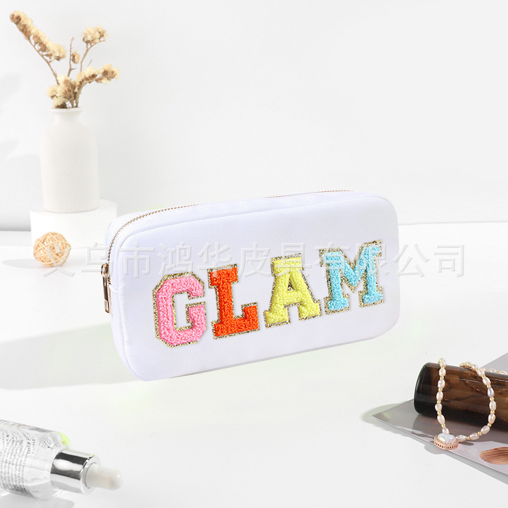 Transfronterizo amazon popular toalla bordada carta de nylon bolsa de cosméticos bolsa de almacenamiento de gran capacidad informal de las mujeres a prueba de agua