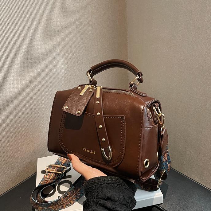 Bolso de viajero retro transfronterizo para mujer 2025 nuevo bolso de Boston casual simple moda bolso de mensajero portátil de todo fósforo